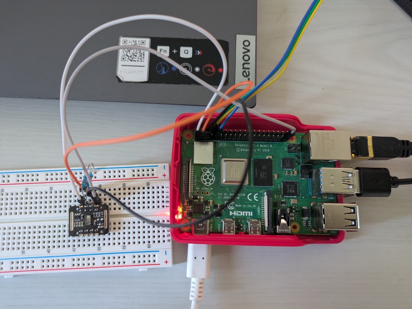 Workbench: Raspberry Pi 4 wired to a sensor breakout on a breadboard